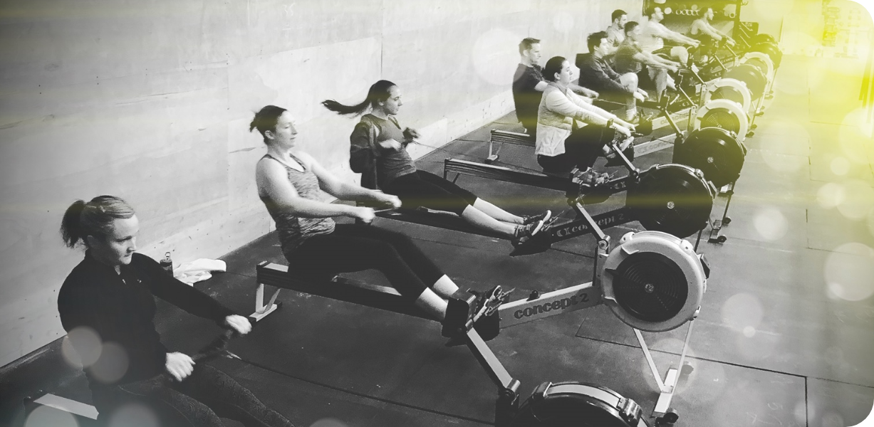 CFP members on CrossFit equipment rowing machines